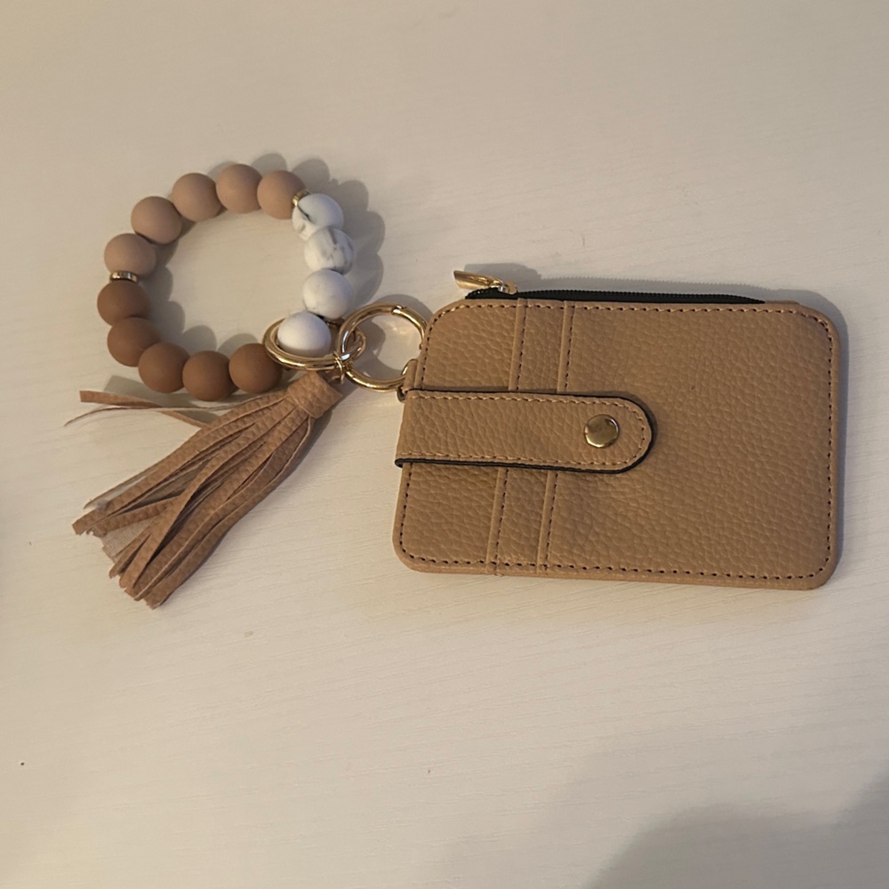 Elegant Tan Card Holder with Tassel and Beaded Bracelet
